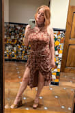 I wore this to a bar mitzvah and it was perfect! I was worried about the dress riding up since it's pretty short in the front, but it is lined which helped it to stay put. I am a 34F and consistently a medium and had plenty of room/the dress fit great. The material is high quality and worth the price, imo. Definitely a fun and unique piece! - Brianna T.