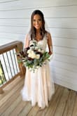 I wore this to my elopement-style wedding and thought it was perfect. I did have to have alterations done to the dress, but very little. Absolutely beautiful! - Demi T.
