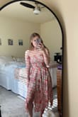 The material of the dress is very light and flows but not revealing or see-through!! It is gorgeous! Although I would've sized up a little just for the arms as the fit is a bit snug! - Katelyn T.