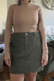 I usually wear a small but got a medium so it could have some more layers underneath. I have worn this skirt with a turtleneck bodysuit and tights before and it was good! - Gabrielle A.