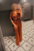 I absolutely loved this set. The material is soft and thick so it's not going to show every little thing on your body. The pants also have the ties on them to attach to the shirt so you can adjust how you please. I was very comfortable in this. - Brianna