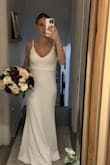 I love the weight of this gown. The cape is lovely and clings just right. I had the straps altered so they don't need to be adjusted and look more custom. I added some accessories and it is just lovely for our small elopement this winter. - Lindsey B.