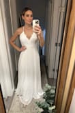 I did not keep it. I found the length a bit uneven and the chiffon, also long. Just not my style. The back was a bit like a beach dress but could always be altered. - Lindsey B.