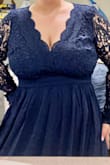 The dress is beautiful! It looks just as pictured. The sleeves we tight as stated in previous reviews- which is my only issue with the gown. Buying a bigger size won't fix the sleeve issue, there is just no stretch to them. Overall, it's gorgeous and I can't wait to get it tailored. - Alex A.