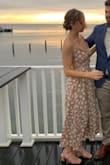 I loved this dress, the color and style are fabulous. However, I spent the entire night yanking up the front so I didn't flash everyone - it does not work on average-sized busts very well. I wish I had had a tailor put a few stitches to close up the busy portion. - Caroline S.
