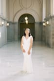 I bought this dress for an elopement photoshoot at San Francisco City Hall. It's stunning! Size medium fit me well and I did not have to make any alterations. The mermaid-style dress really accentuates your assets. My only qualm was the zipper was a bit difficult to zip up and down toward the back. It would get stuck and then I'd have to try zipping it up & down again until it zipped all the way up. Other than this, minor issue, the dress itself was absolutely gorgeous! - Lucy L.