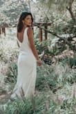 This dress was PERFECT for my wedding! I had an issue with my dress the week of my wedding, ordered this one in a rush, and it turned out better than my original. It fit great; I would have usually been an XS, but that size was unavailable so I went with a Small. It was still fine. I think an XS would have been great, but the fit was still beautiful. Somewhat loose and perfectly flowy and drapey. I'm SO grateful for this dress. - Jennifer V.