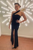 I love the neckline, it's very unique. The dress is sexy yet classy. The slit is a little high for my taste, but it didn't end up being a problem when I sat down. The best part is that I'm 5'2.5" and wore 3 inch heels and it didn't need to be hemmed. The material is quality, very thick with a bit of stretch, so it holds you in. The top stayed in place. Only slight problem is the neckline sort of creeps up on your throat, so that could be annoying. A good purchase. Medium fit me perfectly. - Kris R.
