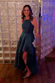 I ordered this dress for a wedding which was non-traditional, guests were encouraged to go wild and stand out! This dress definitely did that. I'm usually a size 4 or a small, I ordered the small and the fit was perfect. The colour was a bit more forest green than emerald, but I was happy with it anyway. The lighting in my photo makes it appear much darker. The material was great quality and had enough weight so it wasn't flimsy. There was no stretchiness to it, and needed to be steamed after being packaged. The only reason I didn't give it 5 stars was because of the darting in the chest, it was higher than it should be and didn't sit perfectly in that area. But overall, I was very pleased with the dress, the cost was reasonable, and I would definitely order from this company again. - Linda C.