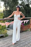 This jumpsuit is absolute perfection. Being 5'7" it's rare a jumpsuit is ever long enough. Not to mention torso and leg ratio was perfect. The thick fabric and the wire in the bust "V" provides so much support and shape. Highly recommended. - Taylor S.