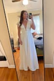 I was surprised by the quality of the fabric!  It is a great fit, I have a smaller bust so I will have to get it tailored just a bit up top but otherwise, it fits great.  Happy with my purchase! - Caitlin C.
