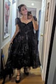 This dress is stunning! The previous reviews were so helpful. I sized up, and it fit like a dream. The sleeves do stand up like fairy wings, but you can unobtrusively tuck them if you want a more understated look. Love it!! I bought it to perform for a classical piano recital but will probably also wear for fall weddings. - Margarita R.