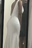 This dress is everything I was looking for in a wedding dress. It's simple but also extremely affordable. The straps are a bit loose and I am planning on getting that and the waist altered for the wedding. I am so excited. The button details on the back are beautiful and the quality exceeded my expectations. - Michelle P.