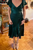 Wore this dress to officiate my cousin's wedding and it was perfect! Gorgeous color, lovely fabric, perfect length, and fits like a glove. Received many compliments all night! Loved the fact that it's a true wrap dress and yet still flowed and twirled beautifully while dancing. I don't have a large chest (& didn't want "the girls" hanging out) so I did need some fashion tape to secure the top to my chest but that was just fine - stayed secure all night. - Lauren R.