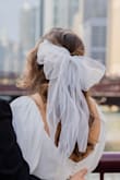 I am obsessed with this bow! It was the perfect complement to my wedding dress and it held its shape through all the walking and strong winds. Looked amazing in photos. I received so many compliments. - Samantha I.