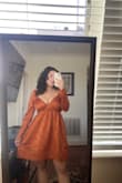 This dress was one of two I bought for potential thanksgiving/holiday dresses, and I absolutely LOVE it. It is slightly loose on the back ties, but that is easily fixable since I sew clothes to fit me all the time. I absolutely adore the bright and rich orange color. It is exactly what I pictured for a thanksgiving dress. The skirt is so flowy but not too much, and the bodice fits my top very well! I don't have to wear a bra at all, which is rare since I'm a 34DDD. Buy this dress for a holiday party or fall wedding. It's perfect for it - Aaliyah