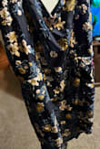 This dress is a scam. It looked extremely cute online; however, it looks nothing like the photos. I will be returning it. - Carissa B.