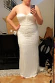 First off, this dress is unbelievably gorgeous!  The beadwork is incredible and high-quality material. It fit well in the front. However, it would be absolutely impossible to zip up, and I'm not that busty. Even ordering up a size, I feel would be unlikely to fix the problem. If you have hips but are small up top, buy this dress. If you're hourglass shaped, it may not work for you. Sad to return. - Jaclyn O.
