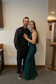 Super comfy, stretchy material. Had a little issue with the zipper getting stuck a few inches from the top, but I just had to be careful and it was fine! I wore it for my brother's wedding in Oct. I am 5' 6" and wore 3-4" heels (I'm not exactly sure), and I did not need to get it hemmed! - Catt M.