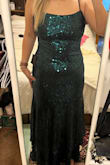 Great dress; it's a pretty stretchy material and not itchy at all. My sister had me get it for her wedding where I'm the MOH. Not sure if I'll wear this because it's a little bit more blue than emerald green. I'm also a little concerned with the material being stretchy if I'll be able to get alterations done. - Lauren M.