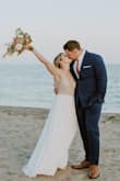 None of my family or guests could believe my wedding dress was less than $300. I did have it altered from off the rack to bring up the front garment length as I'm only 5'4. It was my dream dress and I received so many compliments throughout the course of our ceremony and reception. The skirt is heavy enough to feel expensive, but lightweight enough to flow in the breeze and twirl when I twirled. I'm not a bling girl, but loved the rhinestone and pearl bodice, it was just the right amount of sparkle. I could not wear any shapewear with this dress, as it is extremely low cut in the back, but the empress waist was extremely flattering. I opted not to have the bodice lined as I loved the sheerness on the trunk, but have seen reviews where people did both. - Caitlin P.