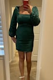 I love the color, the material & the quality of the dress. Besides it being too short it fits true to size. But the dress is super short, & I am not tall I'm only 5/5 & I have short legs. The dress barely covers my backside. I won't be able to wear this to a work Christmas Party. Not sure where I would be able to wear it because it's so short. For some reason, it would not accept the photo of the back of the dress. It's short. - Lisa F.