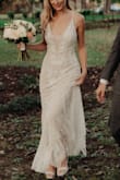 I absolutely loved this as my wedding dress, and I got so many compliments on it. In terms of alterations, I had it hemmed, left a small train on the back, and darted the adjustments on the straps so they wouldn't move. Also, all the beading makes the dress somewhat heavy, and the thin straps kind of dug into my shoulders. To fix this, we put an elastic band around the waist on the inside to help support some of the weight. It was an easy alteration, and it worked perfectly. I loved this dress so much I took it on my honeymoon for a photoshoot. It doesn't really wrinkle so it was easy to pack. - Chelsea M.