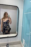 Loved this dress for a wedding guest in Florida. Wore with a sticky bra and had no issues. I had originally bought a small because the medium was out of stock, but I was able to get the medium which fit great. The small was too tight around the chest for me. - Cheryl C.