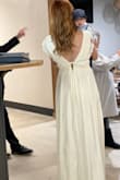 I was hesitant to purchase a dress online, but I had been told personally to trust LuLus.com by a few people, whom each had a good experience. I read many reviews to make the best decision I could, and I must admit that I was thoroughly pleased with my simple dress for my simple wedding. I was thrilled that it was an effortless experience. I had ordered a M, and, after reading reviews, I decided to order a S. Even with my cowgirl boots (3" heel), the dress was nearly touching the floor. This was the perfect length for me since I'm 5'9", and most simple dresses online barely touch the floor on women who are 5'3". Now when I say "simple", I'm not saying boring. The plunge was deeper than I realized, but, with some tape, it helped my breasts in just fine. If I hadn't waited until the last minute, I might have had the shoulders taken in since ppl were commenting they wanted to slip, but I was already expecting that so I was prepared. This was the least anxious dress shopping ever. I'll be back for other dresses for sure! - Angeli L.
