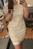 The dress is of amazing quality! Layered, and thick enough, and the beading and detailing are beautiful. I have an hourglass body shape and I was between Medium and Large. Ordered the Large and it was a bit too big, which is fine. But the length is so long. I would have preferred it a bit tighter and shorter for a true bodycon dress fit so I am ordering again in a size Medium. - Adrianna E.