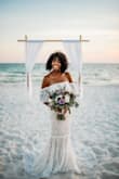 I picked this dress immediately! I was looking for a boho chic dress for our beach wedding. It fits beautifully. The bust area did feel a bit looser on the day of the wedding but I'm certain it was because I'd lost a couple more pounds (wedding stress - not intentional). It photographs beautifully. Our photographer commented how the mermaid tail was simply stunning for a beach ceremony. I got so many compliments. - Erika U.