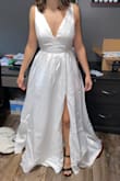 Very pretty dress that's also very comfortable and good quality. After being ironed a bit, it'd be really gorgeous. I was looking for something with more train to it though, which, when I had heels on, this didn't have. The bow was a unique and cute addition that can be easily removed from the buttons it sits on - Mandy B.