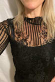 True to size, pretty for a night out or fun event. - Amy T.