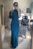 I'm a 6'0 woman on the more petite side, and this dress was wonderful to wear! The material is VERY soft and easy to steam for getting wrinkles out. If you are any shorter than me, you do not need to worry if heels will make the dress look shorter, but if you are naturally short, expect to wear larger heels. I was able to wear a 0.5 inch heel with this dress. I wore this to a wedding and got many compliments. The dress itself in the front is very elegant, but the open back gives it that element of personality you need. There is no stretch to the dress and isn't form fitting if you get a size larger. It honestly just hung on me weird as the hips got larger, and I couldn't fill them (think like gaps in a bra, awkward). I, myself, found going with the smaller size worked. If I went with the small, I got weird edges along the dress that just stuck out, and the neck felt too loose (I bought XS and S to try). Highly recommend trying this dress, and if you're in between sizes, get both and determine which fits better! - Winter C.