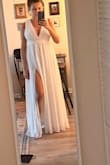It is a beautiful dress, but a bit too tight in the bust. I had to return it because I was looking for something for a simple beach wedding. You can wear this dress at a big ceremony. Nicely sewn, good material. - Olga K.