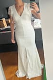 I really liked this dress. It was unique, easy to wear, and it has a lot of stretch to it. I have a muscular build and a wide rib cage. I ordered the small and it was a good fit. A little long in the length but not too bad. The dress felt comfortable on and fit in the places you wanted it to. - Brittney P.