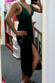 The dress doesn't have much stretch, if any, but luckily, it did fit! It was definitely more formal fitting on me than the model since my hips are fuller. The slit was also a little higher than I expected it, making it a sexy outfit! It got plenty of compliments. - Yelitza G.