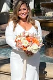 I was so worried these dresses wouldn't fit but they fit amazingly, I had the bottom tailored for my short height. The buttons go along the zipper and make the dress feel so glam and luxurious. I couldn't be happier! They added a garment bag complimentary which was very generous! Ships quickly as well. - Rebecca S.