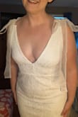 This is beautiful, and l love the tie ribbons at the shoulders. Very unique. It is the perfect length for me at 5'7" but may be too short with heels. Train is beautiful and not too long. Very deep v neckline, so if you are larger chested, it may be too revealing!! - Lauren K.