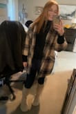 I'm a size medium usually but ordered a small and I'm glad I did! It's oversized but great for layering. I wore it on Halloween night and it kept me warm. So cute with a turtleneck or even a hoodie underneath! The only thing that would make it better would be a hood. - Shay H.