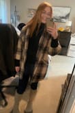 I love love love this!! I want one of every color. The fit is perfect, waist length so it doesn't hang over my bum, loose enough to do the "french tuck" if I want to. It's super cute layered under the Lulus jacket I bought! - Shay H.