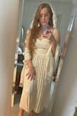 Love the dress. It needs a slip for sure. It's a little bit thin and see-through material but nicely made. The zipper was difficult to zip. You have to zip it a few times to "break it in", and then, it starts to loosen. Pretty! - Rhye G.