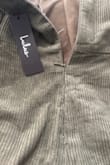 This piece runs small. The zipper isn't secure enough. It was too expensive for the quality I got. - Isabel C.