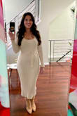 This dress is definitely form fitting. I have an hourglass shape; I wore this with some spanx and felt great in it. It can be a little lower cut in the boobs but doesn't necessarily have to be, so you could wear it out or to work. I'm a big fan. - Amy S.