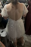Wore this as my reception dress. It was perfect for dancing the night away. I did end up tucking the loose edge of the sleeves under for more of a bubble sleeve look, but it wasn't too itchy or anything. Got so many compliments on the back. Would recommend this dress - Summer C.