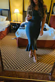 The size recommended to me was a large and I'm so happy I went with a medium. It fit perfectly, was super easy to slide on (since no zipper), and never rode up or fell down (sleeves/bust). I got so many compliments on the shape and color. The fabric was very comfortable too! I love this dress and can't wait to wear it for other events! - Laura P.