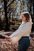 Love this top, I got a large, but honestly probably could have worn a medium and had a better fit. But because my photoshoot was already scheduled, I didn't have time to exchange. I have a little bit of a tummy and this was super flattering with some high-waisted pants for my engagement photos. I can't think of a bra that would be easy to wear with this as it's quite low cut, but some boob tape worked nicely and the girls looked great in it! 

Honestly, I will probably re-wear it for my bachelorette party! - Courtney S.