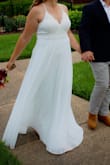 Absolutely perfect wedding dress! Flowing and very flattering. I loved it for my small wedding! - Emily M.