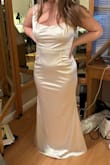 So beautiful but I had to put $200 into it to alter it. I had it hemmed (it has a lining too), taken in at the waist, straps were adjusted, and I had a bra added. It was for my daughter's second dress for her upcoming wedding so we have no regrets but for this type of material, it needs to fit perfectly - it's gorgeous on her and she feels great in it. Photos are after alterations. - Katie M.