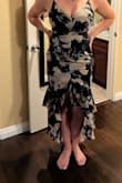 I honestly love this dress !! I'm a 32C. It did fit a little snug right under my boob area but a good set of Spanx fixed it. It shows just enough of my chest area not exposing so much, felt very elegant. Also, this has a slight stretch to it just enough to breath. - OLIVIA D.